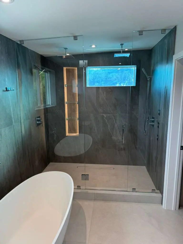 Frameless shower door installed in a Nassau, Bahamas bathroom
