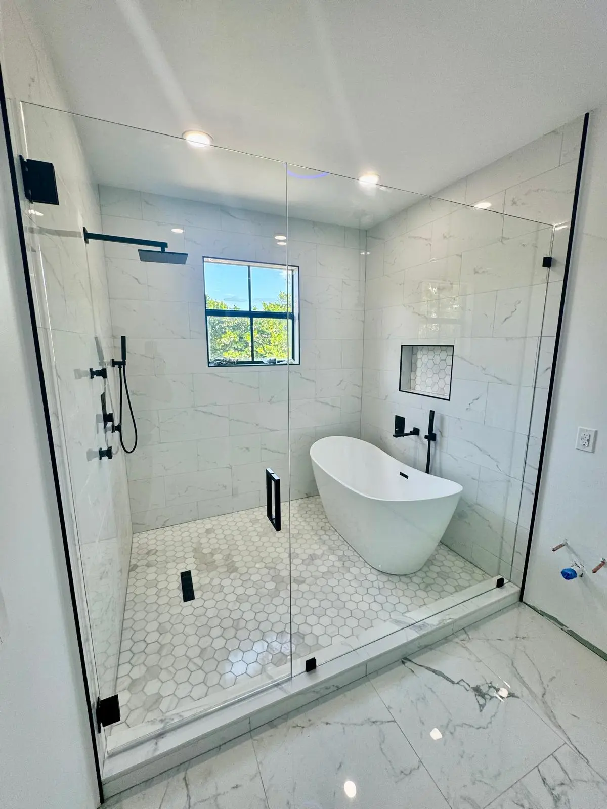 Frosted glass shower door with stainless steel hardware, Nassau Bahamas